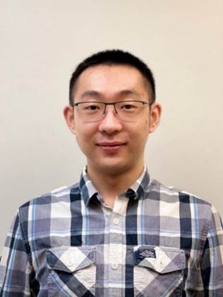 A person wearing glasses and a plaid shirt

Description automatically generated